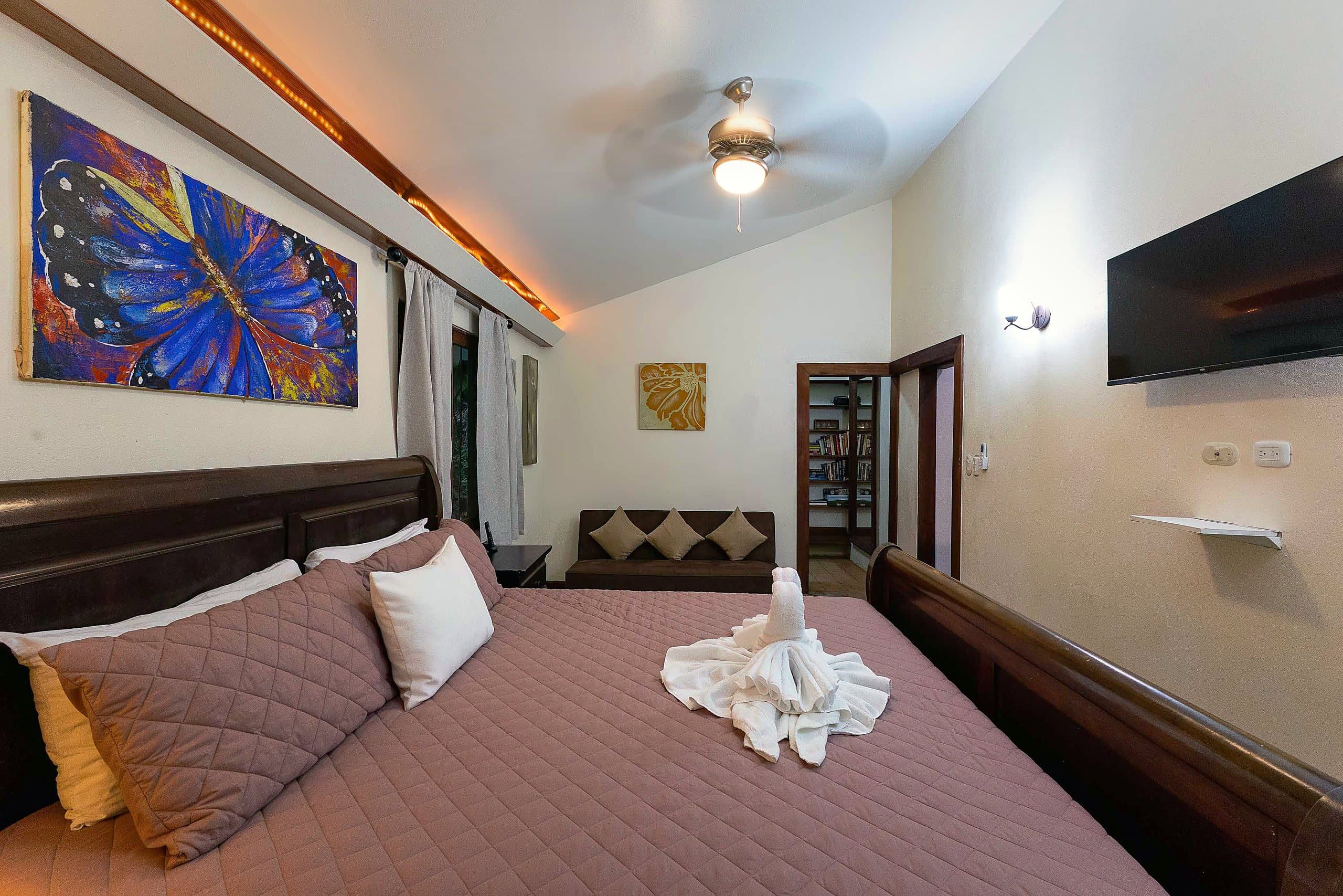 Master bedroom with blue morpho butterfly painting