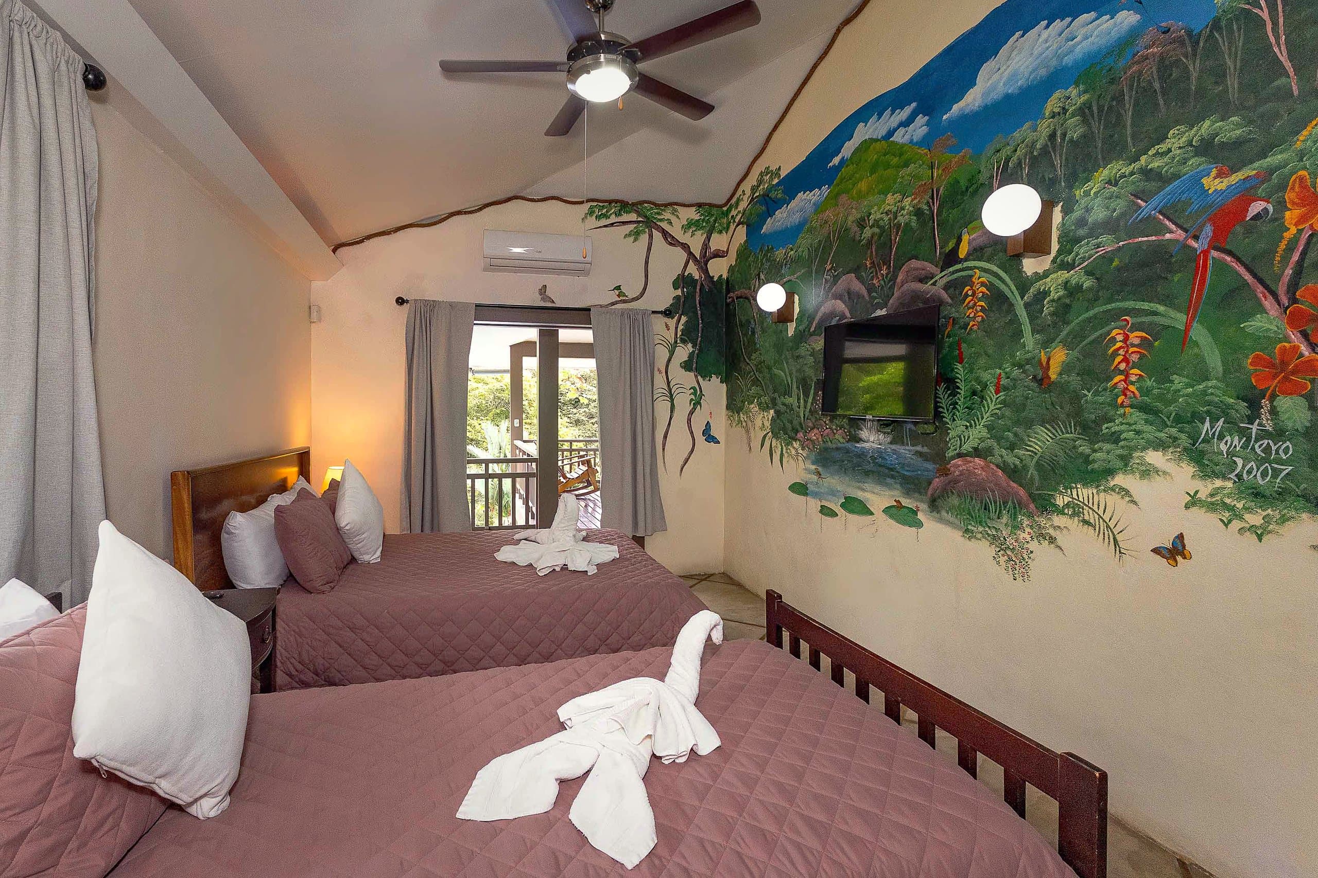 Bedroom with hand-painted jungle mural